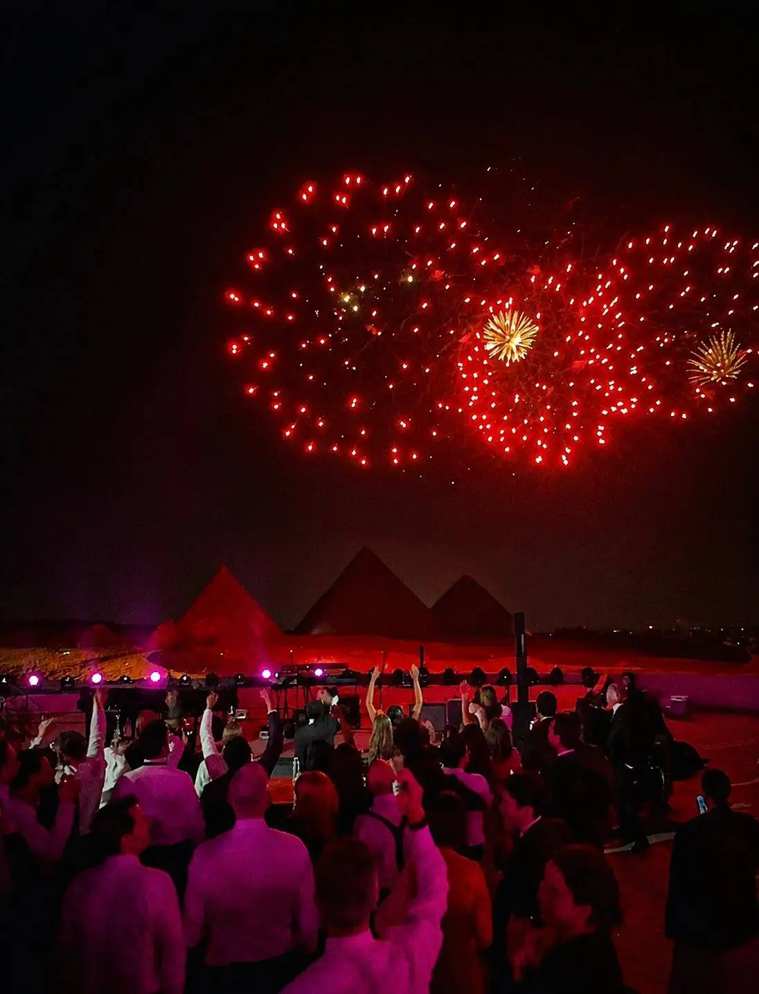 Fireworks over the pyramids at night